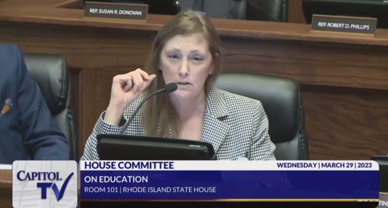 Rep. Sherry Roberts explains to teacher Lindsay Paiva that children in school may be abused at home & sexual content in school could be traumatic